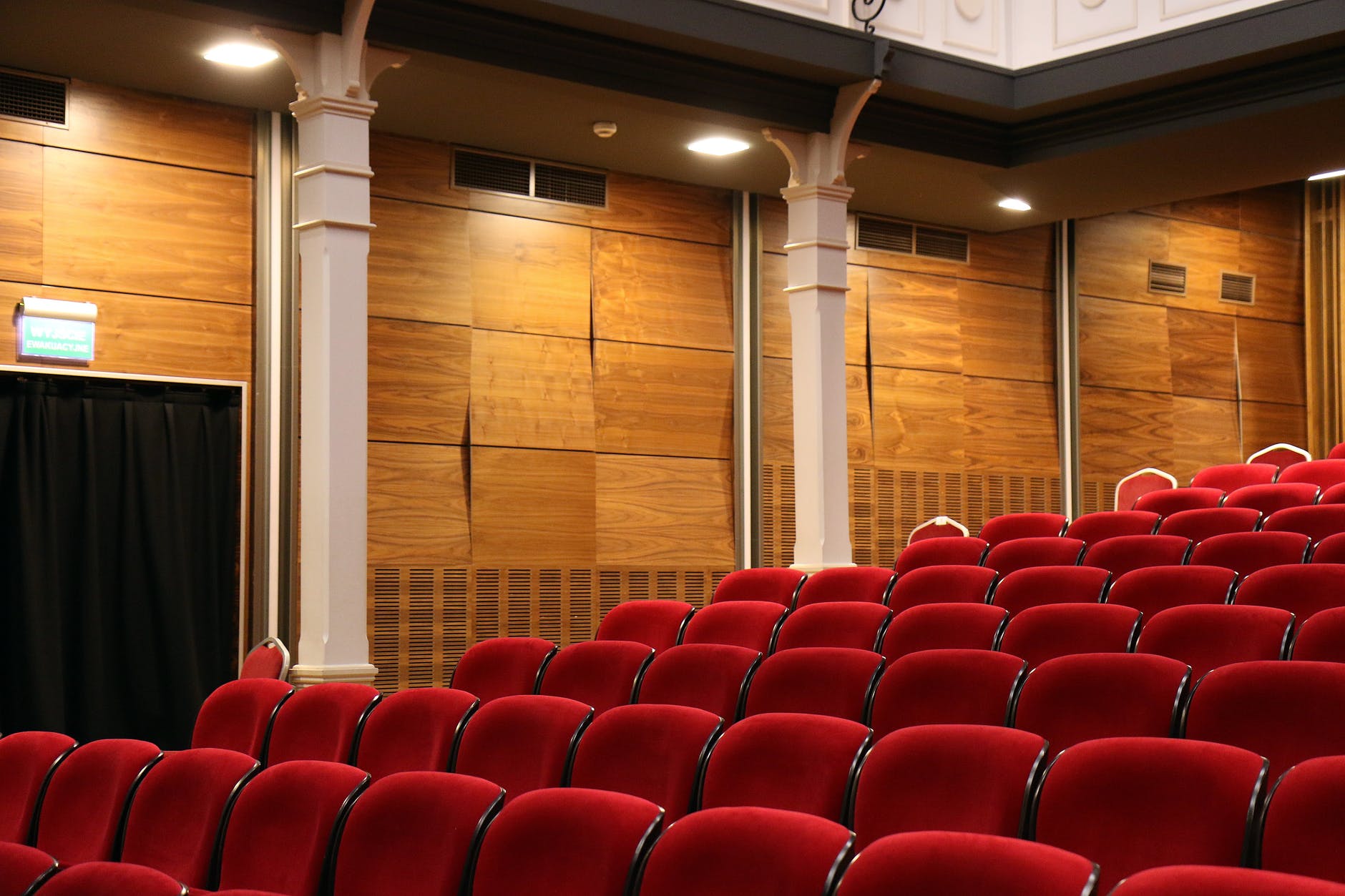 Row of red chairs in theatre hall